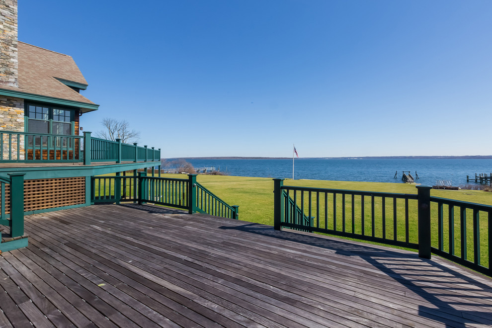 Huge arts and crafts backyard deck photo in Providence with no cover