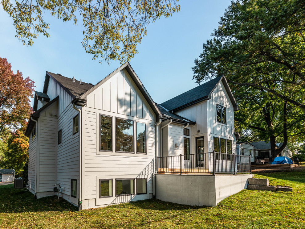 Example of a farmhouse exterior home design in Kansas City