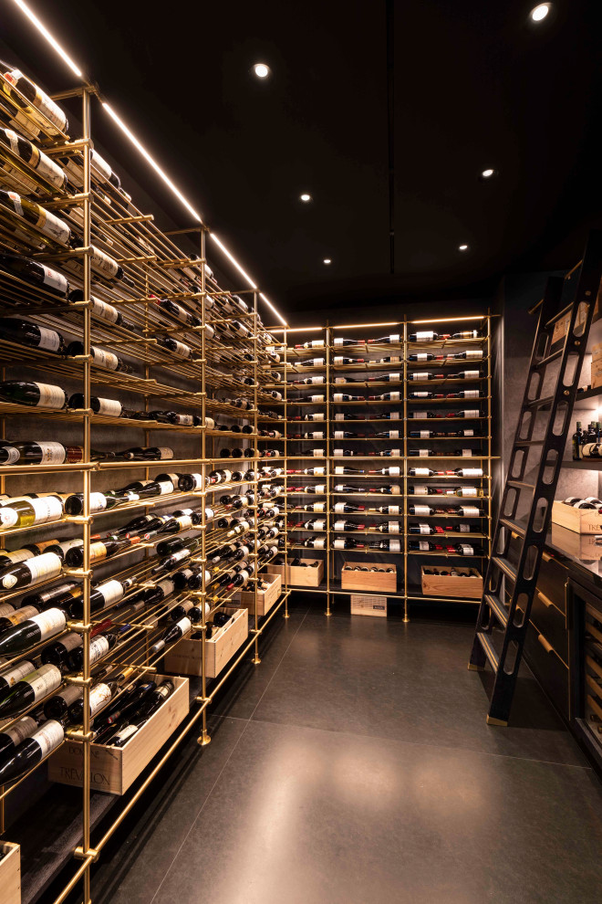 Example of a mid-century modern wine cellar design in New York