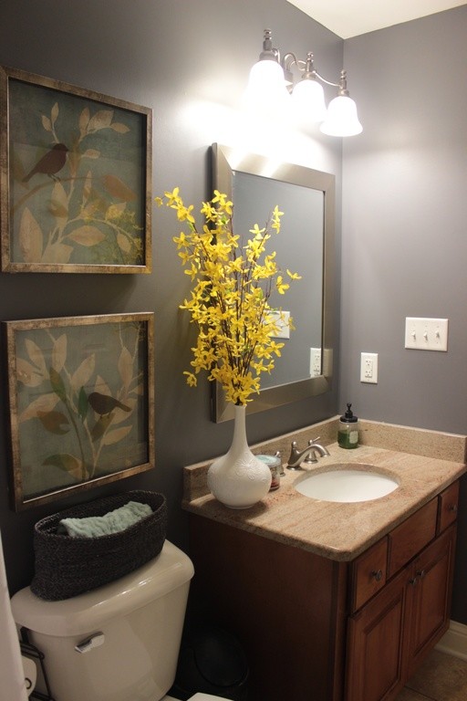Example of a mid-sized transitional 3/4 bathroom design with recessed-panel cabinets, medium tone wood cabinets, blue walls and granite countertops