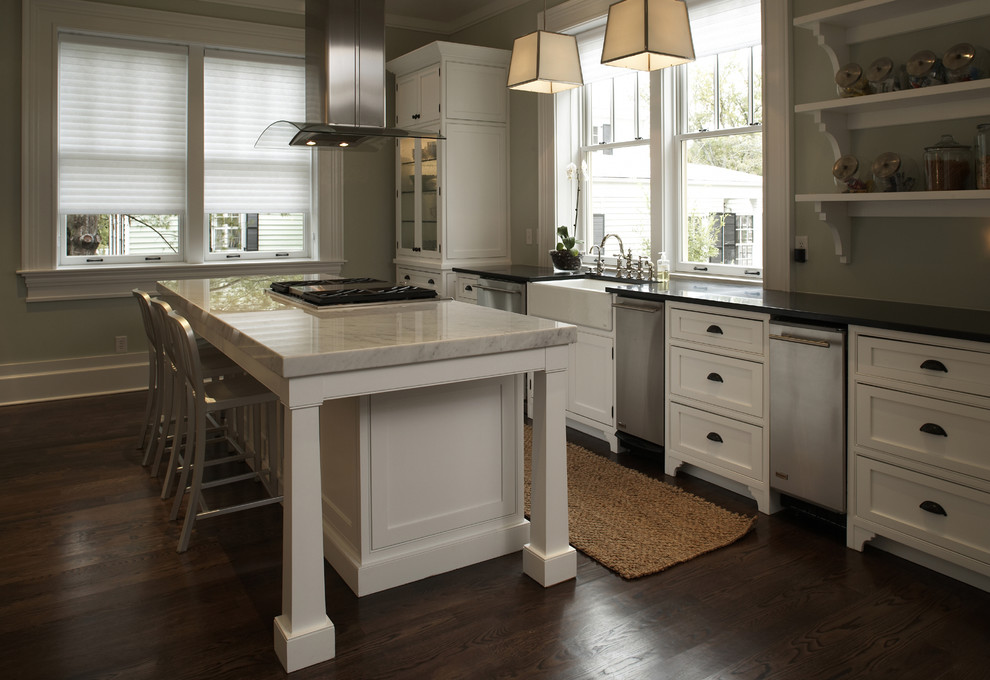 Inspiration for a mid-sized transitional l-shaped eat-in kitchen in Wilmington with a farmhouse sink, flat-panel cabinets, white cabinets, stainless steel appliances, dark hardwood floors and with island.