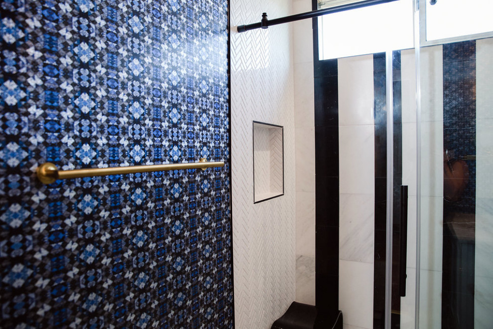 Eclectic bathroom in Austin with an open shower, black and white tile, a shower seat and wallpaper.