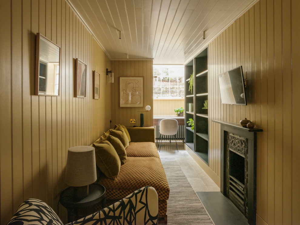 Photo of a classic enclosed living room in London with yellow walls, a standard fireplace, a wall mounted tv, grey floors, a timber clad ceiling and tongue and groove walls.