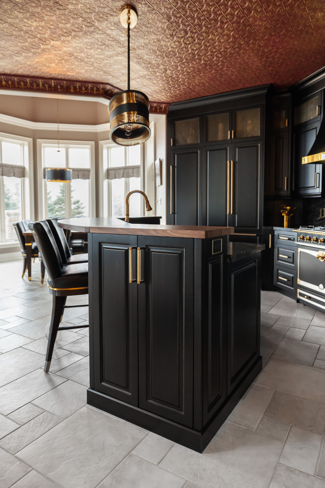 Kitchen - large eclectic kitchen idea with raised-panel cabinets, black cabinets, granite countertops, black backsplash, granite backsplash, paneled appliances, an island and black countertops