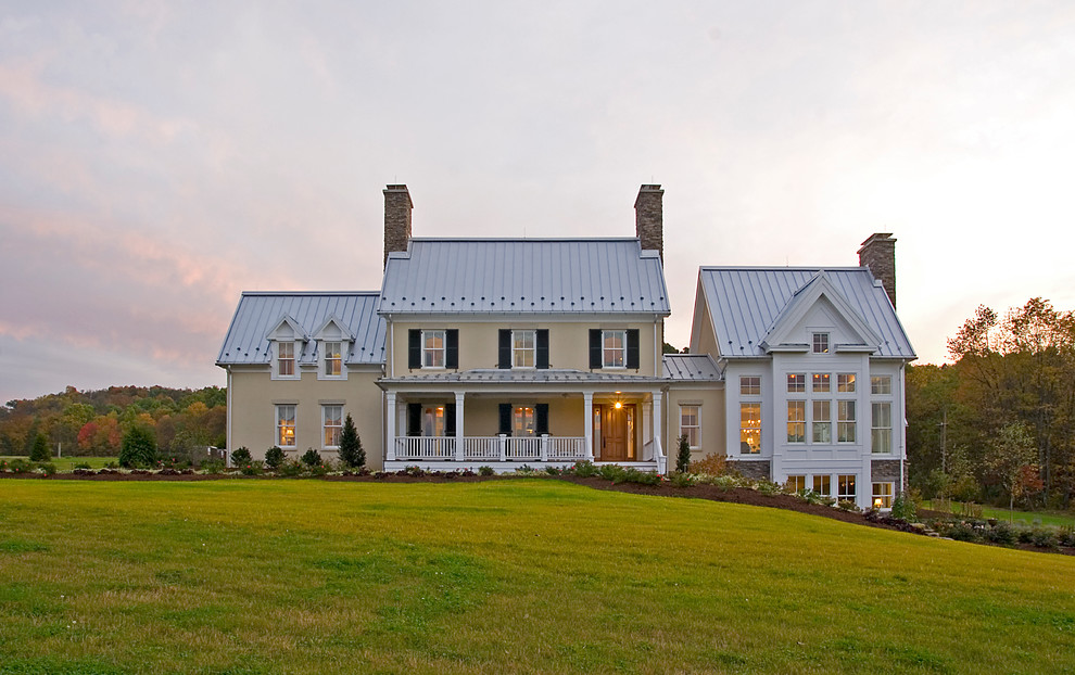 Large traditional two-storey beige exterior in Richmond with mixed siding.