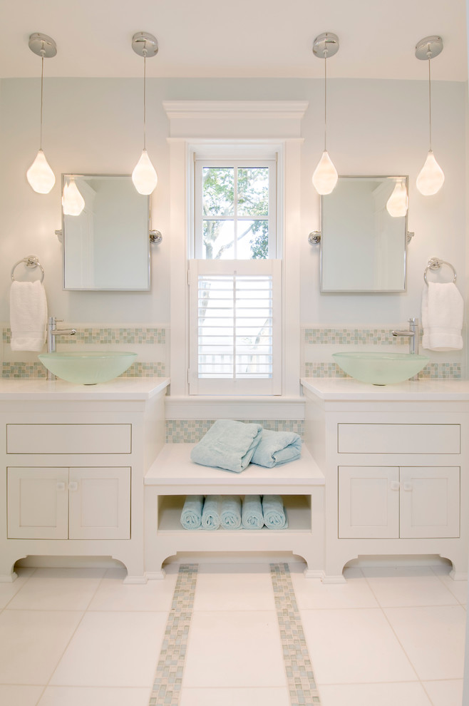 This is an example of a large transitional master bathroom in Boston with a vessel sink, white cabinets, multi-coloured tile, mosaic tile, blue walls, ceramic floors, marble benchtops, white benchtops and shaker cabinets.