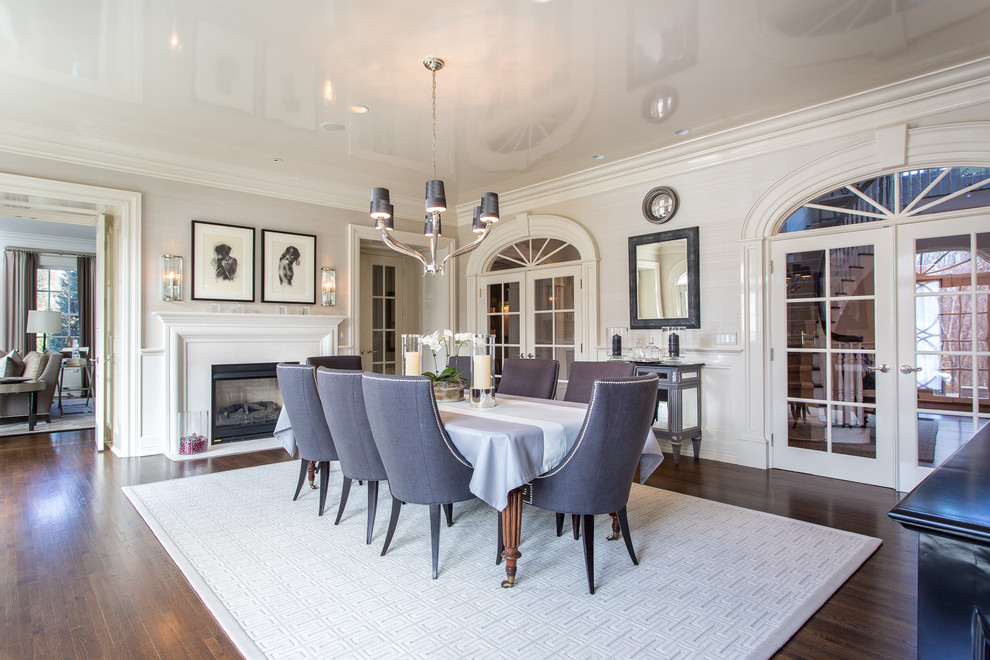 Traditional separate dining room in New York with white walls and dark hardwood floors.