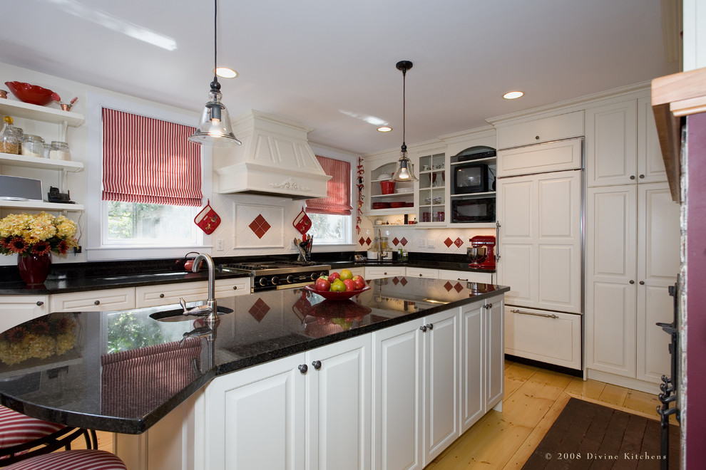 Design ideas for a large traditional u-shaped eat-in kitchen in Boston with an undermount sink, granite benchtops, red splashback, light hardwood floors and with island.