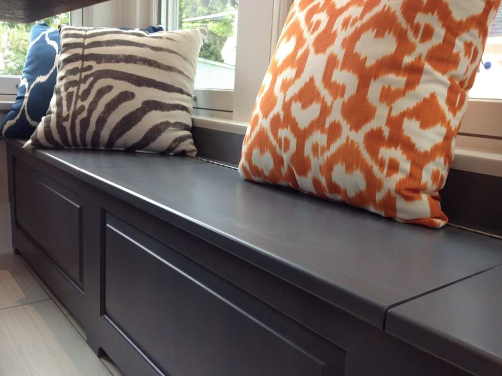 Example of a large transitional u-shaped porcelain tile eat-in kitchen design with a farmhouse sink, flat-panel cabinets, gray cabinets, marble countertops, white backsplash, ceramic backsplash, white appliances and no island