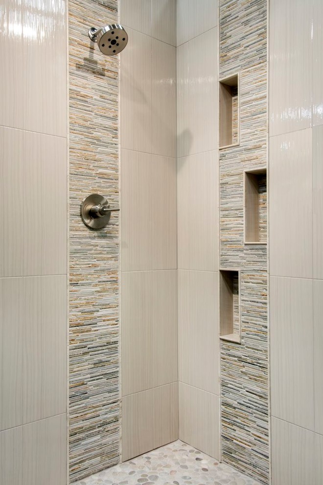 Inspiration for a mid-sized traditional bathroom in Toronto with white cabinets, a corner shower, multi-coloured tile, limestone, ceramic floors, marble benchtops, beige floor, a hinged shower door and multi-coloured benchtops.