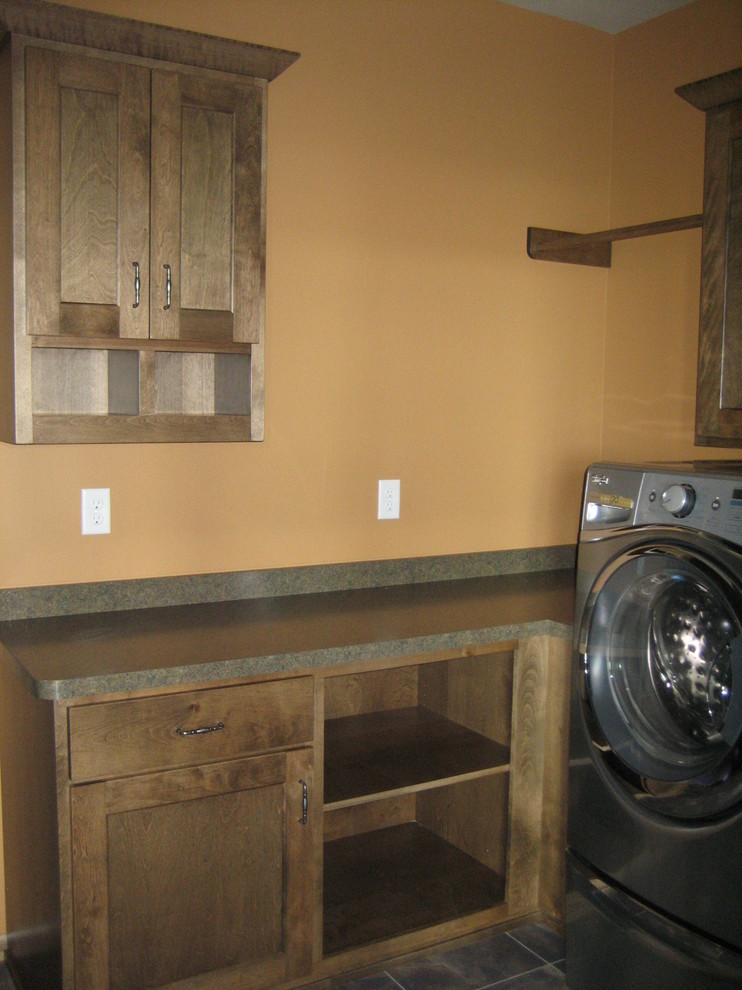 Inspiration for a mid-sized rustic mudroom remodel with orange walls