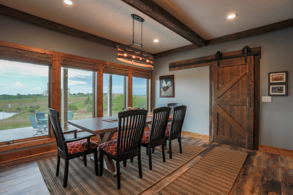Mountain style vinyl floor dining room photo in Omaha with blue walls