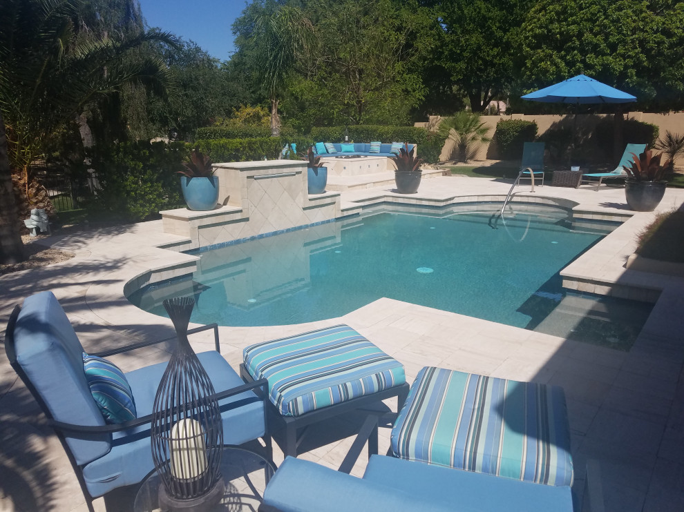 Pool - transitional stone pool idea in Minneapolis with a fire pit and a roof extension