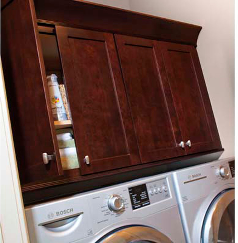 Design ideas for a laundry room in Other with dark wood cabinets.