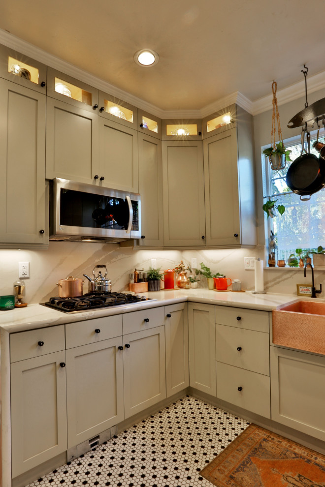 Example of a mid-sized french country l-shaped multicolored floor eat-in kitchen design in Sacramento with a farmhouse sink, shaker cabinets, white cabinets, quartz countertops, white backsplash, quartz backsplash and white countertops