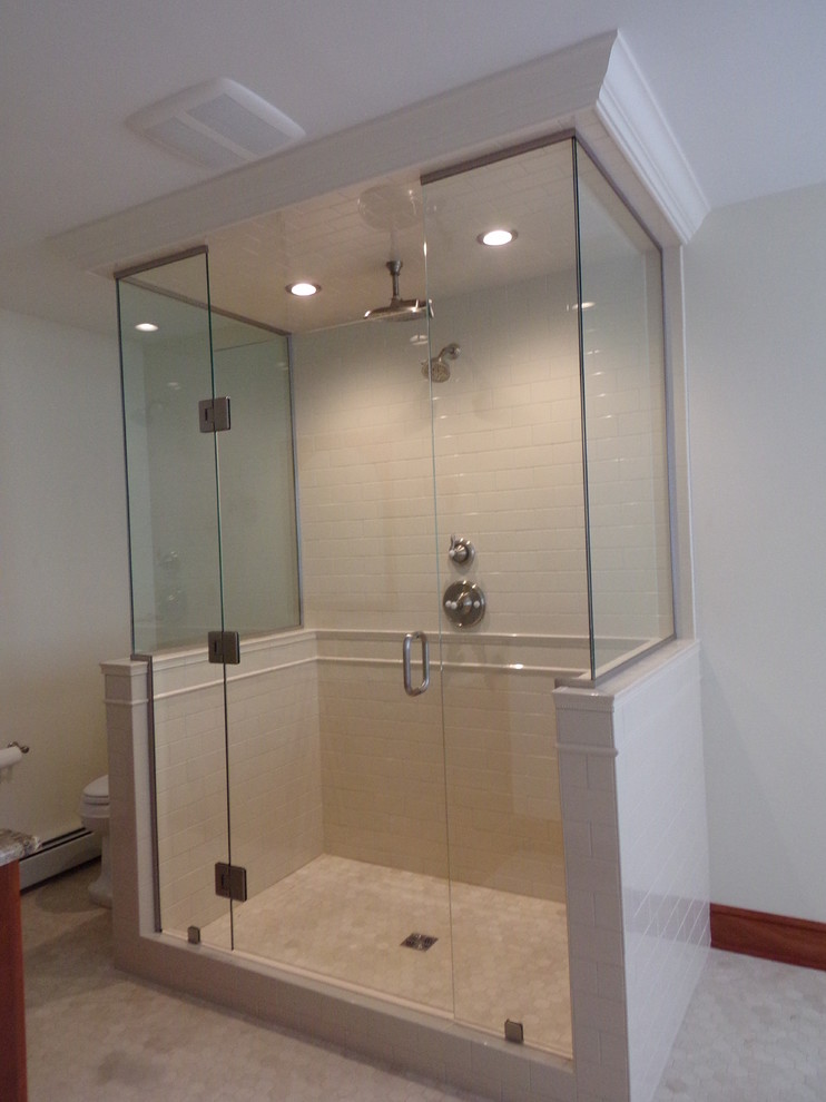 This is an example of a large traditional master bathroom in Other with medium wood cabinets, a freestanding tub, an open shower, white tile, ceramic tile, white walls, marble floors, an undermount sink and granite benchtops.