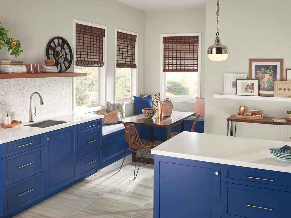 Example of a large transitional beige floor eat-in kitchen design in Indianapolis with blue cabinets, white backsplash, mosaic tile backsplash, stainless steel appliances and an island