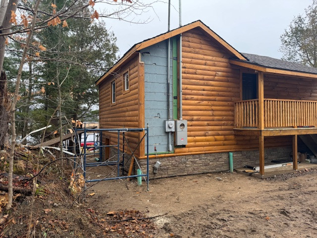 Log Siding, Stamped Concrete and Post and Beam Carport