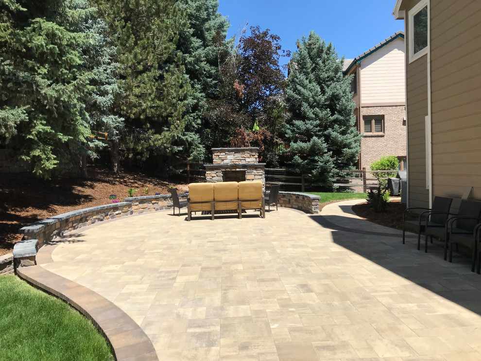 Patio - mid-sized traditional backyard concrete paver patio idea in Denver