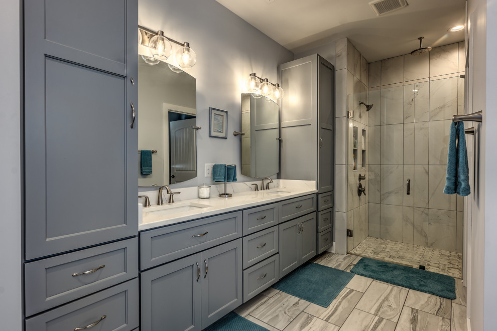 Inspiration for a large craftsman master ceramic tile, beige floor and double-sink bathroom remodel in Atlanta with shaker cabinets, gray cabinets, a two-piece toilet, beige walls, an undermount sink, quartz countertops, a hinged shower door, white countertops and a built-in vanity