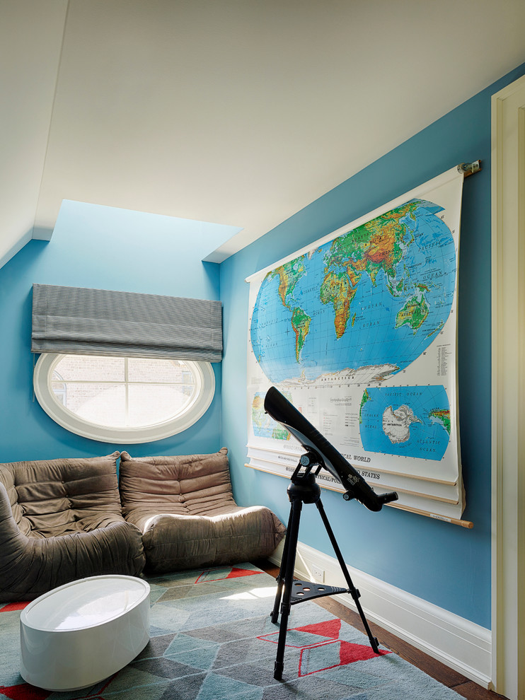 This is an example of a traditional gender-neutral kids' room in Baltimore with blue walls and dark hardwood floors.