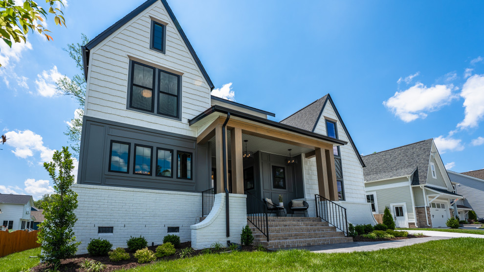 The Cardinal - Large transitional white three-story gable roof idea in Richmond with a mixed material roof and a black roof