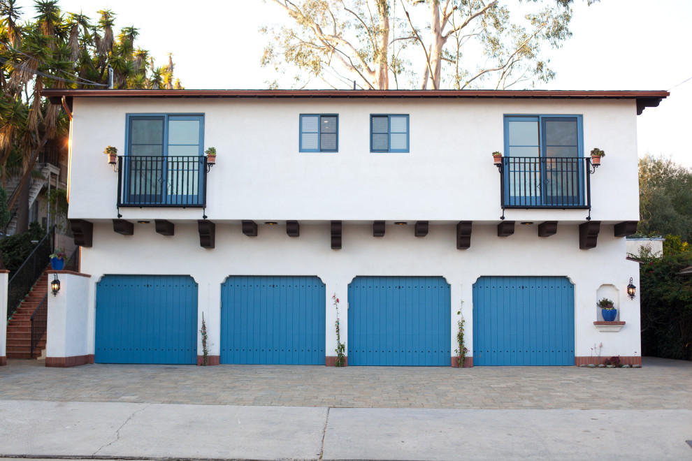Design ideas for a mediterranean attached four-car garage in Santa Barbara.