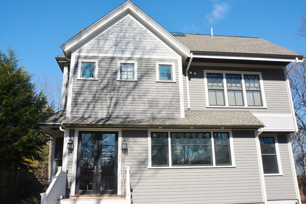 Inspiration for a large transitional gray three-story wood exterior home remodel in Boston