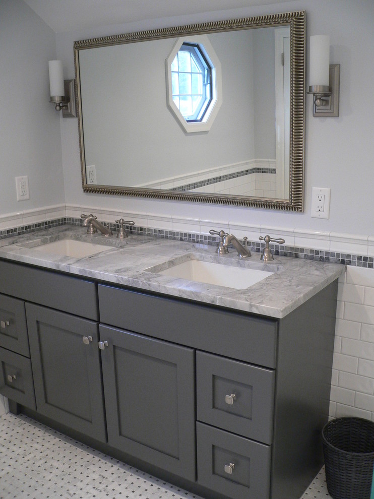 Design ideas for a mid-sized transitional 3/4 bathroom in New York with an undermount sink, shaker cabinets, grey cabinets, granite benchtops, a curbless shower, a two-piece toilet, gray tile, ceramic tile, grey walls and mosaic tile floors.