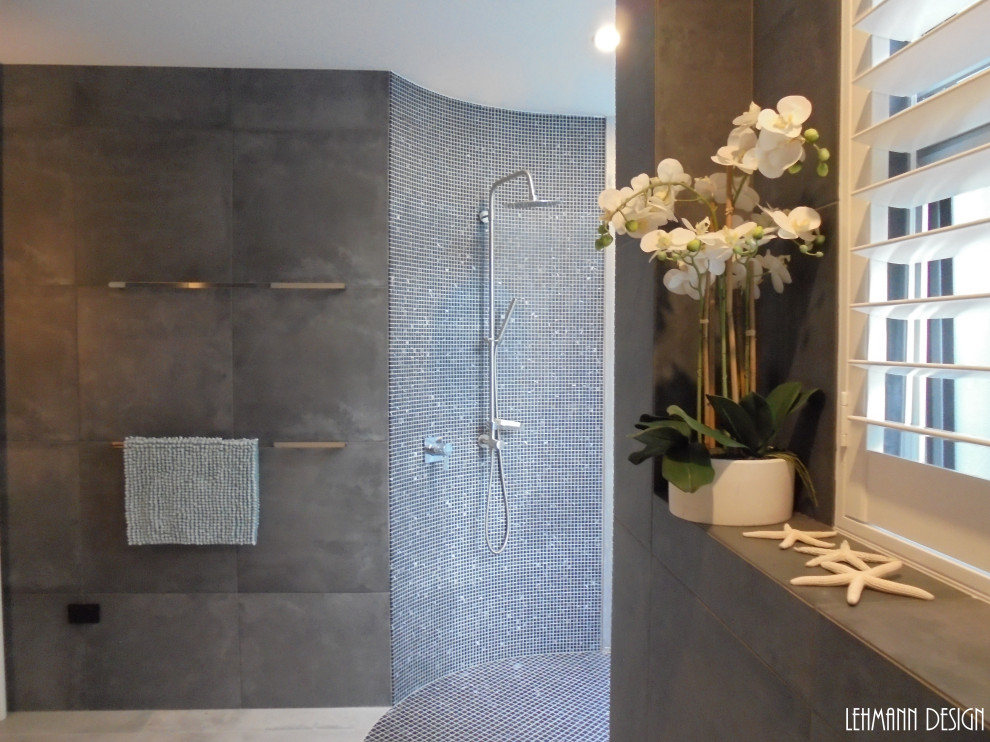Inspiration for a large contemporary master bathroom in Sunshine Coast with flat-panel cabinets, white cabinets, an open shower, gray tile, porcelain tile, grey walls, porcelain floors, a vessel sink, wood benchtops, grey floor, white benchtops, a double vanity and a floating vanity.