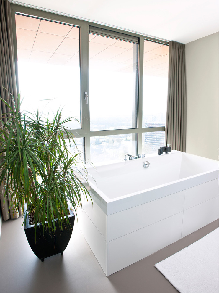 Inspiration for a modern bathroom in Amsterdam with a freestanding tub.