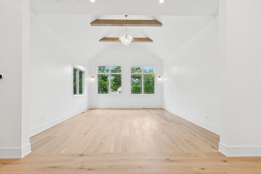 Vaulted Living Room with Exposed Beams and Natural Light