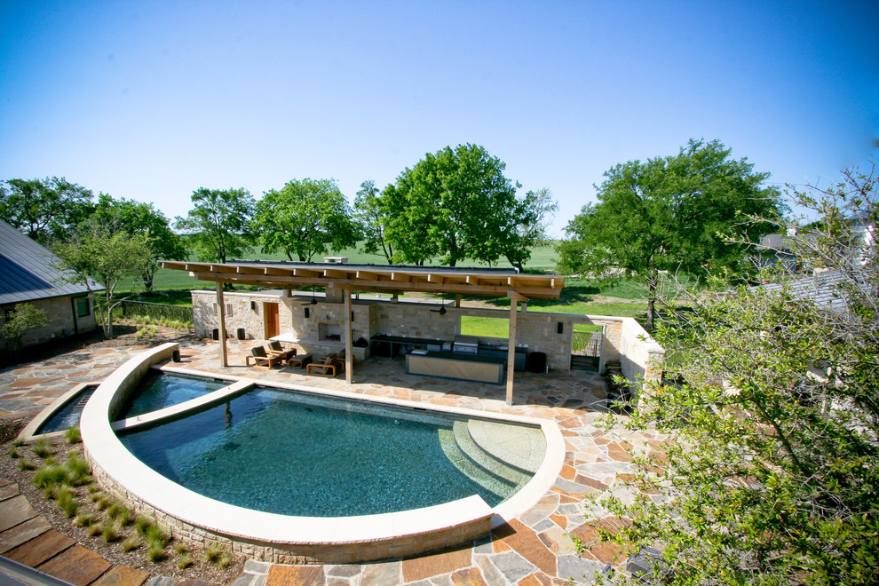 Design ideas for a contemporary pool in Dallas with natural stone pavers.