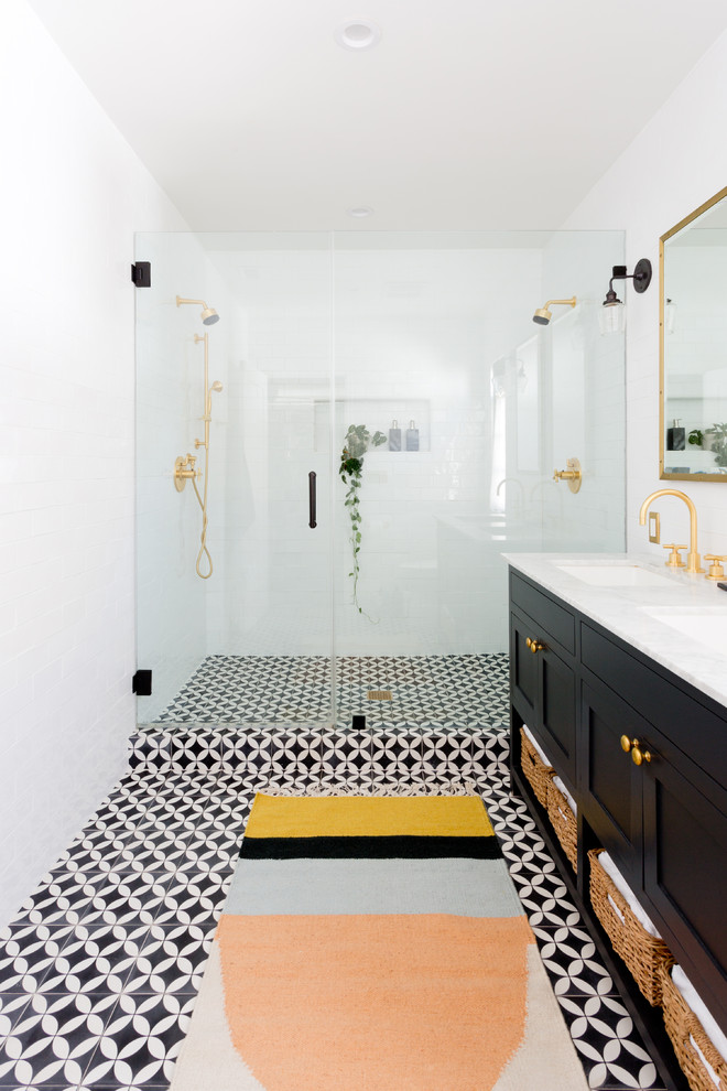 Inspiration for a transitional bathroom in Los Angeles with shaker cabinets, black cabinets, an alcove shower, white tile, subway tile, an undermount sink and a hinged shower door.
