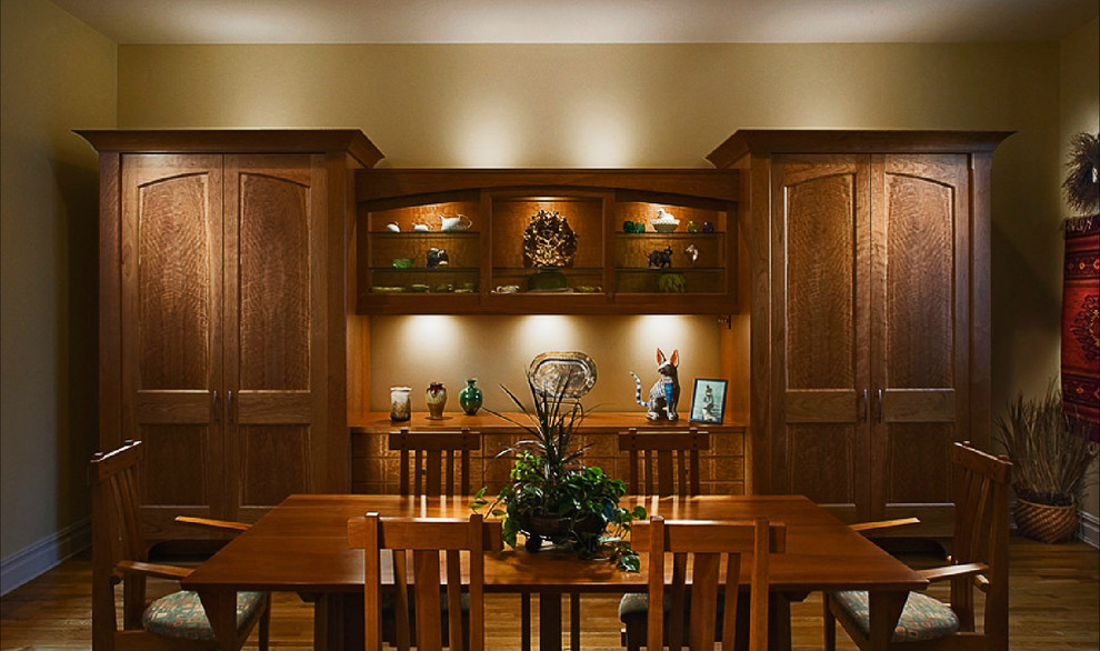 Inspiration for a medium tone wood floor dining room remodel with beige walls and no fireplace