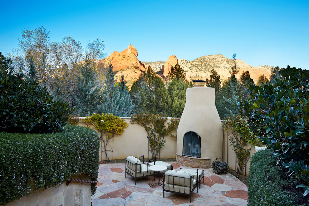 Photo of a patio in Phoenix with no cover and with fireplace.