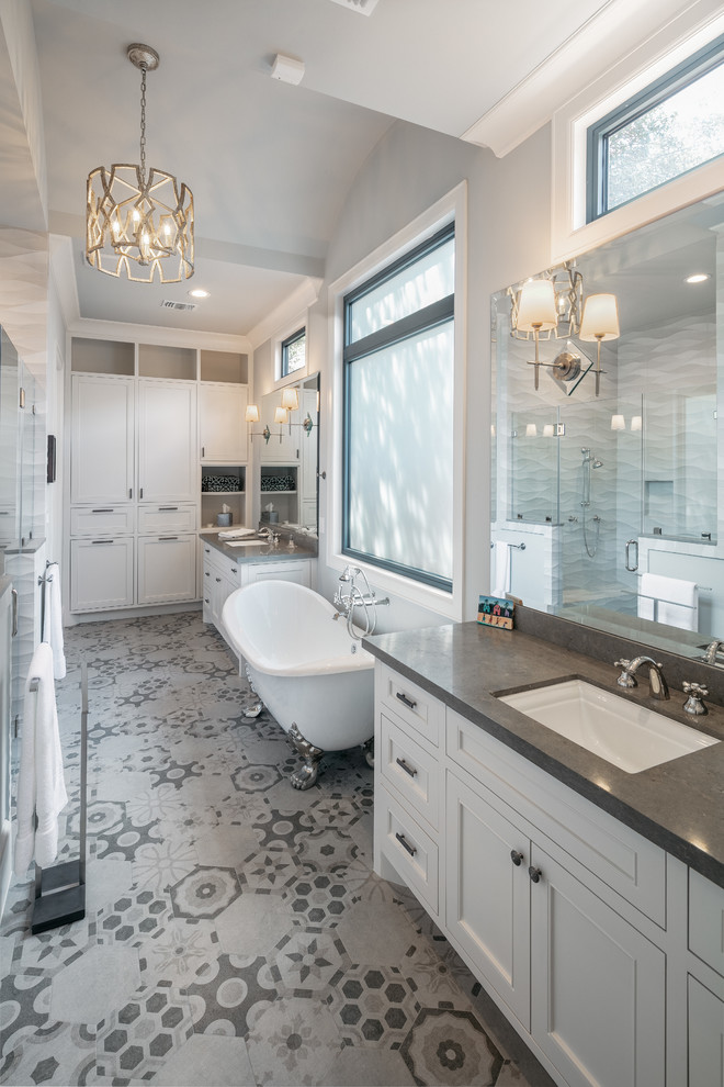 This is an example of an expansive transitional master bathroom in Houston with shaker cabinets, white cabinets, a claw-foot tub, an open shower, grey walls, an undermount sink, grey floor, a hinged shower door, grey benchtops and a built-in vanity.