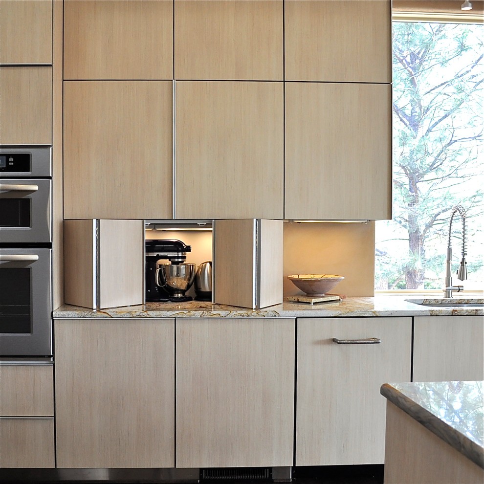 Inspiration for a modern kitchen in Denver with light wood cabinets.