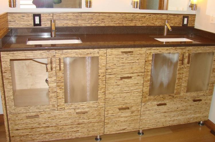 Example of a beige tile porcelain tile bathroom design with white cabinets, granite countertops and a hot tub