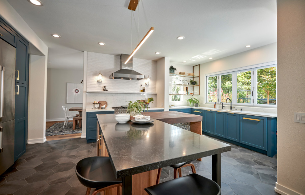 Design ideas for a large midcentury u-shaped open plan kitchen in Denver with an undermount sink, recessed-panel cabinets, green cabinets, quartz benchtops, white splashback, ceramic splashback, stainless steel appliances, porcelain floors, with island, grey floor and white benchtop.