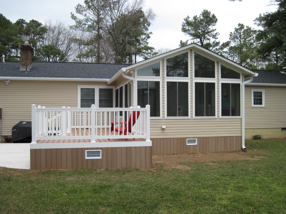 This is an example of a small traditional backyard patio in Other with decking and no cover.