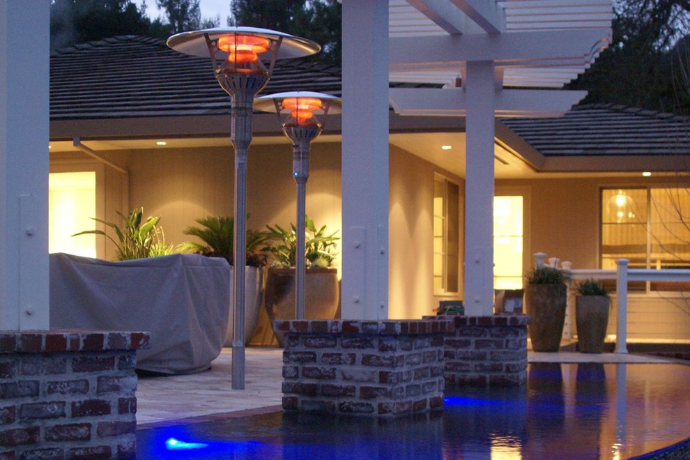 This is an example of a large modern partial sun backyard brick water fountain landscape in Phoenix for summer.