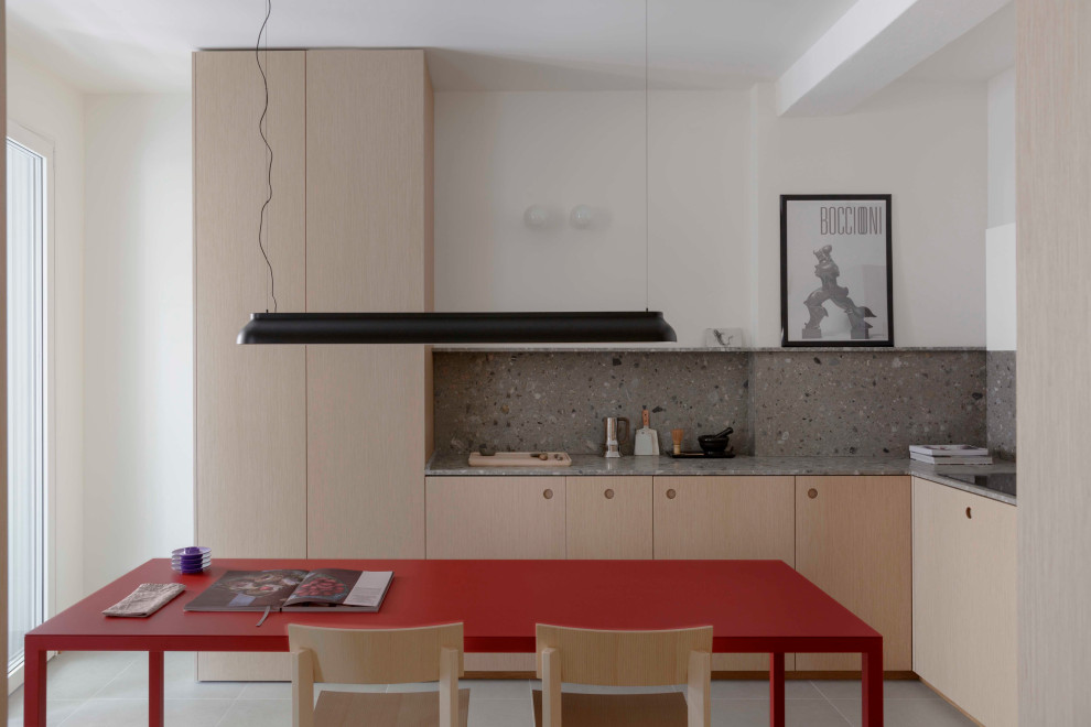 Idee per una piccola sala da pranzo design con pavimento in gres porcellanato e pavimento grigio