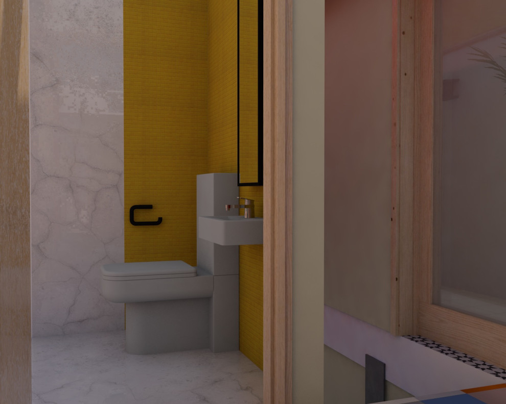 Immagine di un piccolo bagno di servizio etnico con WC monopezzo, lavabo sospeso e top giallo