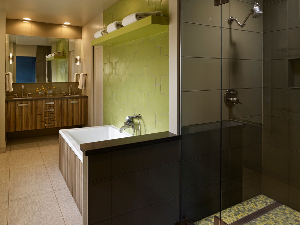 Contemporary bathroom in Denver with an alcove shower, flat-panel cabinets, dark wood cabinets, a drop-in tub and green tile.