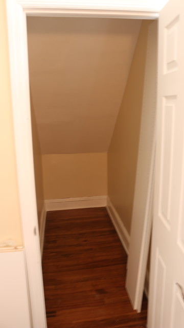 Deep Narrow Angled Ceiling Walk In Closet Contemporary