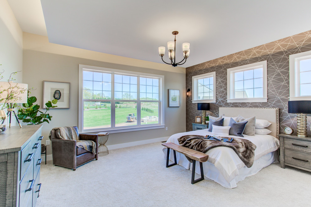 This is an example of an expansive arts and crafts master bedroom in Other with beige walls, carpet and beige floor.