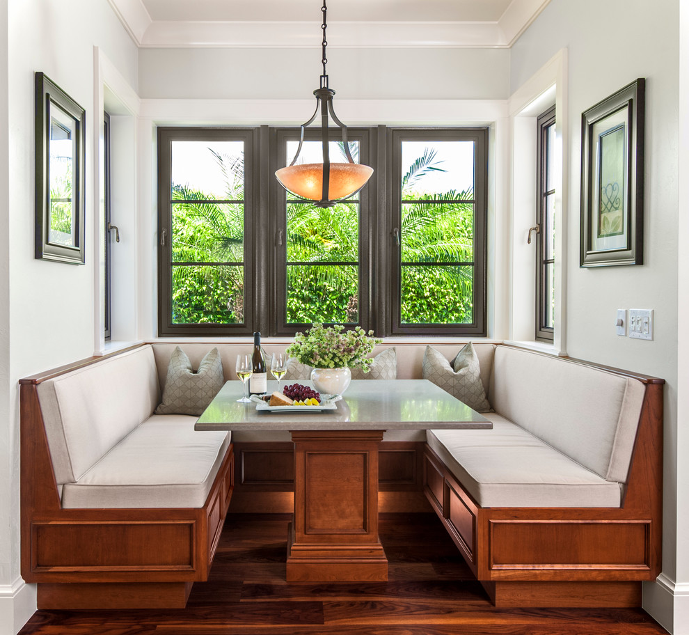 Traditional dining room in Other with dark hardwood floors.