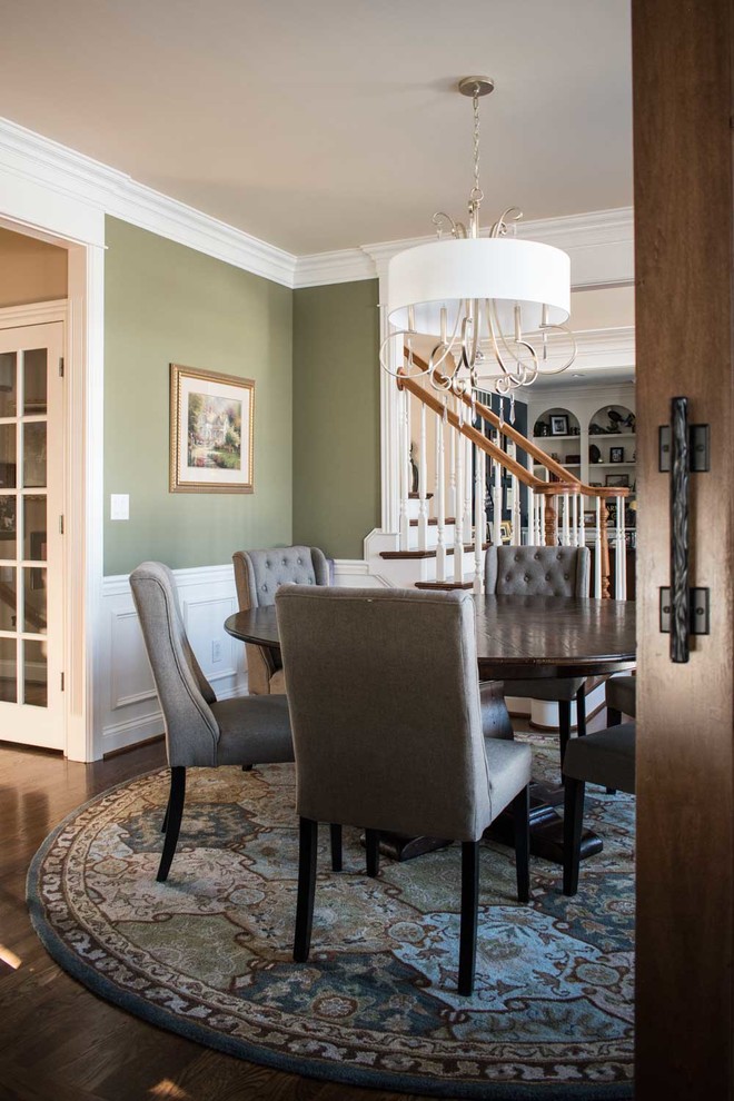 Inspiration for a mid-sized country separate dining room in Louisville with green walls and medium hardwood floors.
