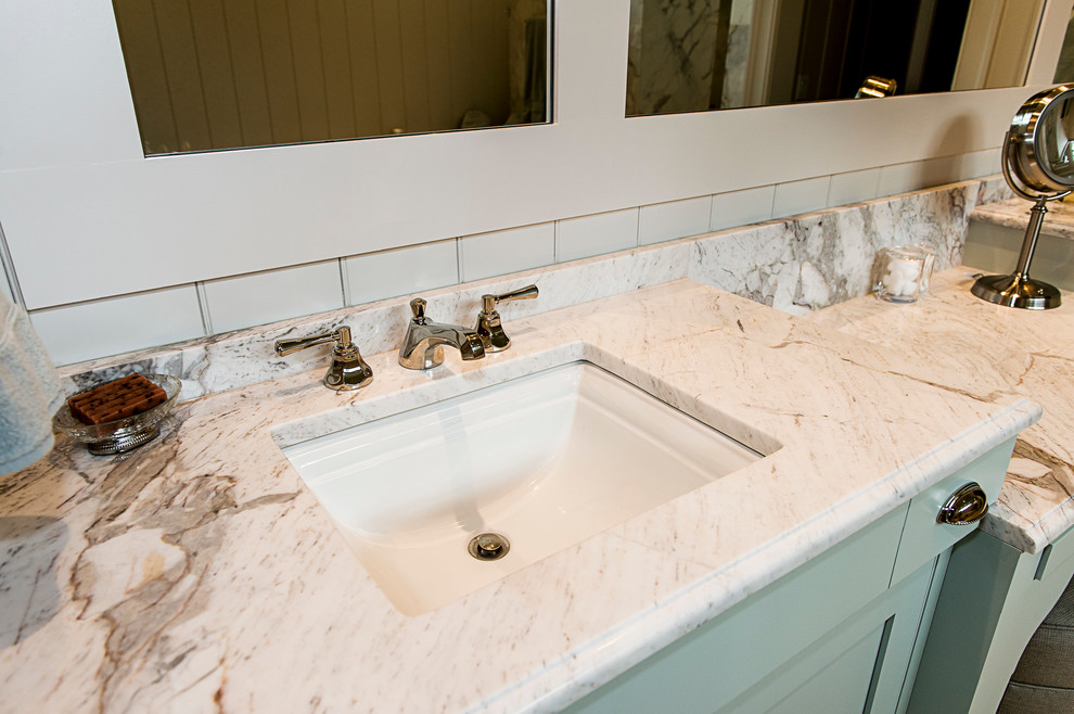 Inspiration for a large contemporary master bathroom in Charleston with shaker cabinets, white cabinets, a drop-in tub, a curbless shower, beige tile, beige walls, marble floors, an undermount sink, marble benchtops and stone tile.